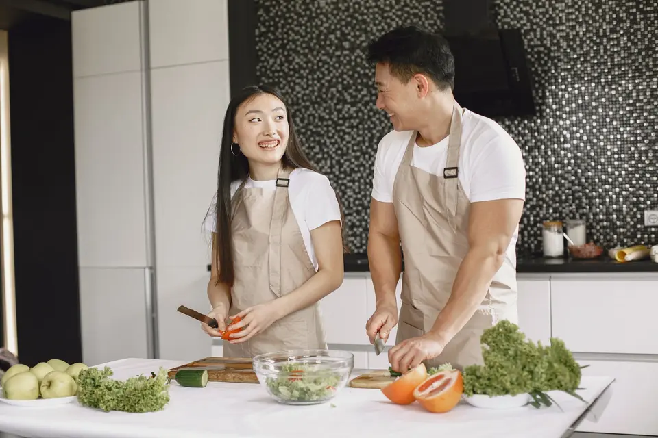 Couple cooking together at home